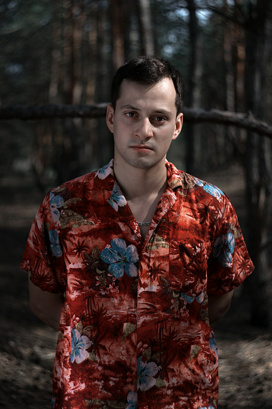 Portrait of a man with short dark hair in a shirt